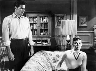 Marge (Gloria Talbot) is getting suspicious of Bill (Tom Tryon), in I Married a Monster from Outer Space 1958.