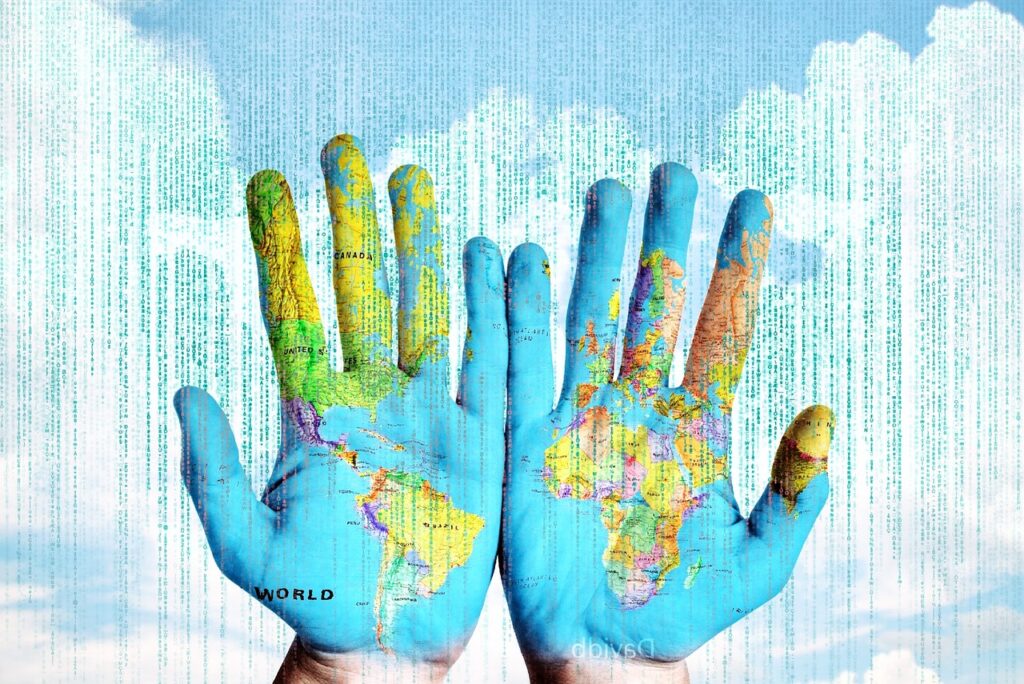 Image of hands with digital bits and world map superimposed