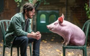 Man and pig in conversation