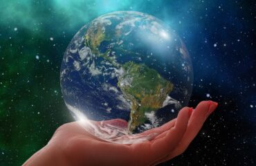 Image of hand holding the Earth