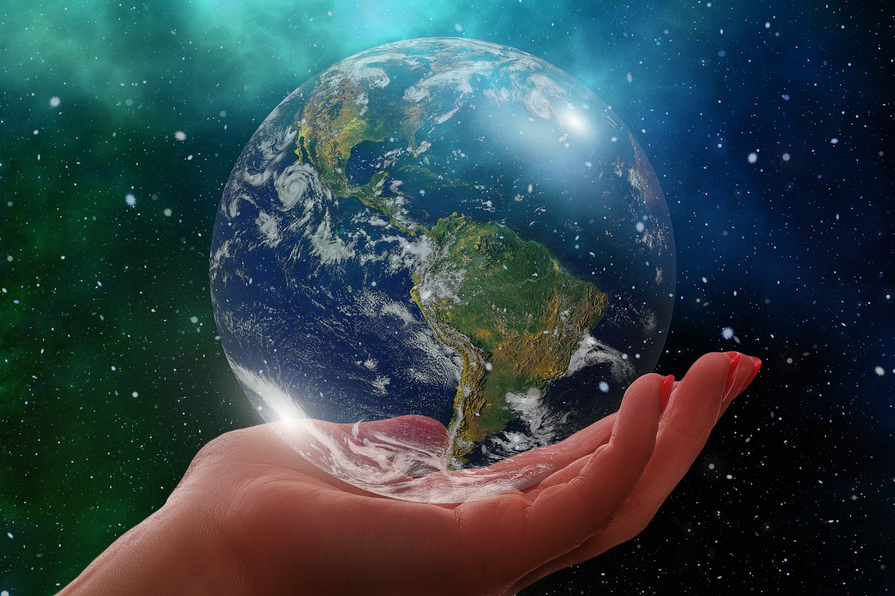 Image of hand holding the Earth